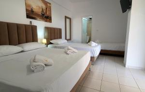 Postel nebo postele na pokoji v ubytování Hotel de Ksamil