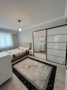 a bedroom with two beds and a large mirror at NEW CONCEPT APARTMENT in Istanbul
