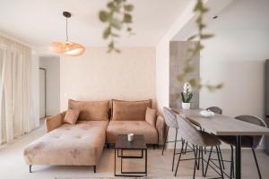 a living room with a couch and a table at Apartments Mila in Sveti Filip i Jakov