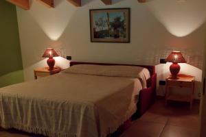 Postel nebo postele na pokoji v ubytování Agriturismo Il Melograno + 34 fotografií