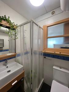 a bathroom with a shower and a sink at Costa Daurada Apartaments - COLON in Salou