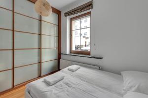 Posteľ alebo postele v izbe v ubytovaní Grand Apartments - Balticana Apartment