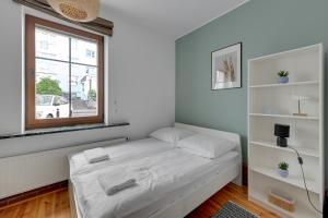 Posteľ alebo postele v izbe v ubytovaní Grand Apartments - Balticana Apartment