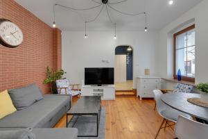 Televízia a/alebo spoločenská miestnosť v ubytovaní Grand Apartments - Balticana Apartment