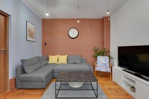 Televízia a/alebo spoločenská miestnosť v ubytovaní Grand Apartments - Balticana Apartment
