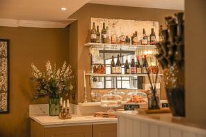 a bar with a lot of bottles of wine at The Yard in Bath Hotel in Bath