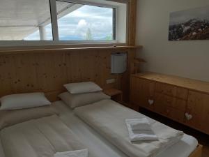 Ένα ή περισσότερα κρεβάτια σε δωμάτιο στο Apartment Fastenberg Schladming - Top11 by AA Holiday Homes