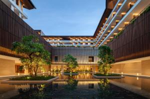 a rendering of a building with trees in the courtyard at The Taikang Sanya, a Tribute Portfolio Resort in Sanya