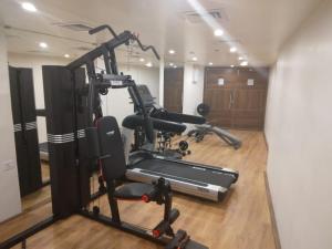 a gym with several exercise bikes in a room at Fort Manor in Trivandrum