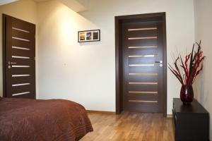 Posteľ alebo postele v izbe v ubytovaní Apartamenty Smile
