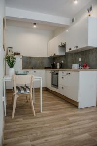 Η κουζίνα ή μικρή κουζίνα στο Stylowe apartamenty
