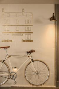 a bike parked against a wall with a drawing of a building at The Yard in Bath Hotel in Bath