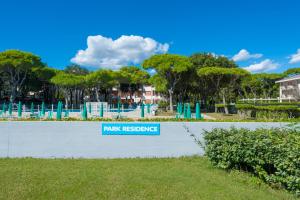 a park with a sign that reads park residence at Park Residence Immobiliare Pacella in Lido di Jesolo