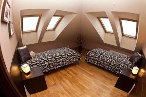 Posteľ alebo postele v izbe v ubytovaní Apartamenty Smile