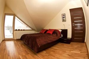 Posteľ alebo postele v izbe v ubytovaní Apartamenty Smile