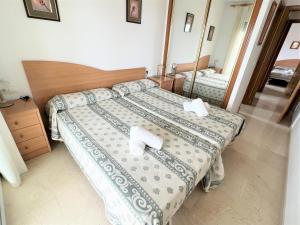 Ein Bett oder Betten in einem Zimmer der Unterkunft Gemelos 22-3-12