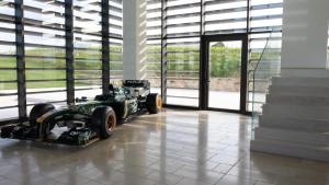 a racing car parked in a room with windows at Foresteria Castorani in Alanno