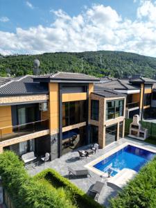 an aerial view of a house with a swimming pool at SAPANCA ALHARRAN VILLA in Sapanca