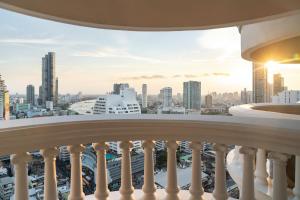 a balcony with a view of a city at lebua at State Tower in Bangkok