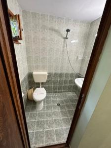 a bathroom with a toilet and a sink at Zora Camping - Bungalows in Obzor