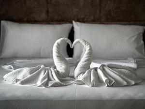 Postel nebo postele na pokoji v ubytování Poseidon Hotel 2 Ksamil