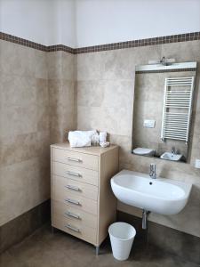 a bathroom with a sink and a mirror at Casa Emilia - Appartamento per vacanze - Foligno in Foligno