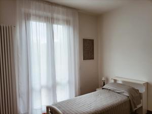 En eller flere senge i et værelse på Casa Emilia - Appartamento per vacanze - Foligno