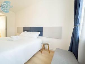 Postel nebo postele na pokoji v ubytování Slataper 19 Tirabora Short Rent