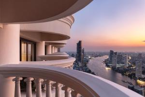 a balcony of a building with a view of a river at lebua at State Tower in Bangkok