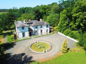 an aerial view of a house with a large driveway at Kirkhill Estate Rooms in Gorebridge