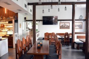 a dining room with wooden tables and chairs at Hotel ROSE Břeclav in Břeclav