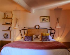 Postel nebo postele na pokoji v ubytování Le petit hotel