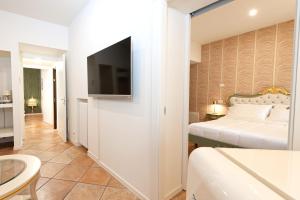 TV a/nebo společenská místnost v ubytování Residenza Catullo