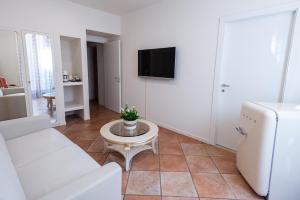 TV a/nebo společenská místnost v ubytování Residenza Catullo