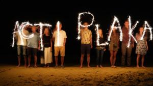 a group of people spelled out with sparklers at Acti Plaka Hotel in Plaka