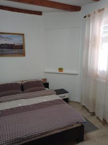 Ένα ή περισσότερα κρεβάτια σε δωμάτιο στο Kuca za odmor Zlaja