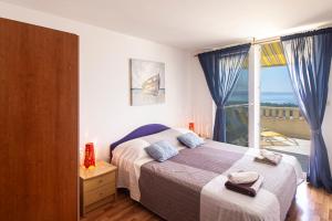 Postel nebo postele na pokoji v ubytování Apartments Branka