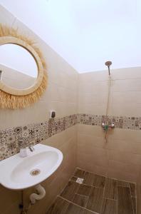 a bathroom with a sink and a mirror at Hostel BE 20 in Marrakech