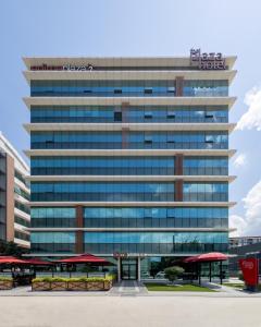 an office building with a hotel sign on top at The Plaza Hotel Edirne in Edirne