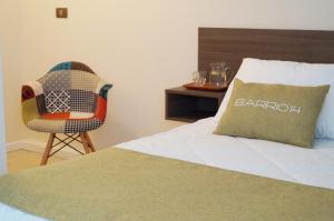 A bed or beds in a room at Hotel Boutique Barrio 14