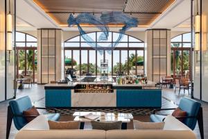 eine Wiedergabe der Lobby des Resorts in der Unterkunft Sheraton Haikou Hotel in Haikou