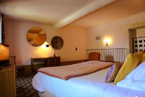 Postel nebo postele na pokoji v ubytování Le petit hotel