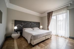 Кровать или кровати в номере Villa Neri Resort & Spa