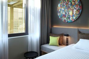 Postel nebo postele na pokoji v ubytování Moxy Athens City