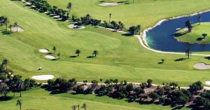 an overhead view of a golf course with a lake at Kailua Dream in Almerimar