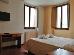 Casa per Ferie Ulivo d'Assisi客房内的一张或多张床位