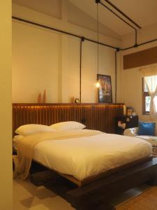 a bedroom with two beds in a room at Makai NAP in Ban Lam Pi