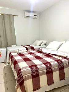 Ein Bett oder Betten in einem Zimmer der Unterkunft Hotel Casa Blanca