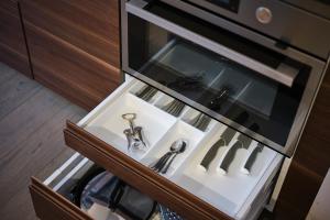 a bathroom with a sink in a cabinet at Aparthotel Rimska 14 in Prague