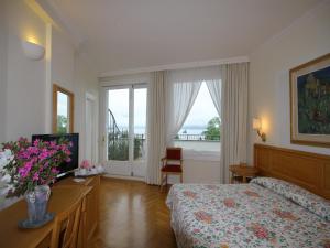 Postel nebo postele na pokoji v ubytování Hotel Royal